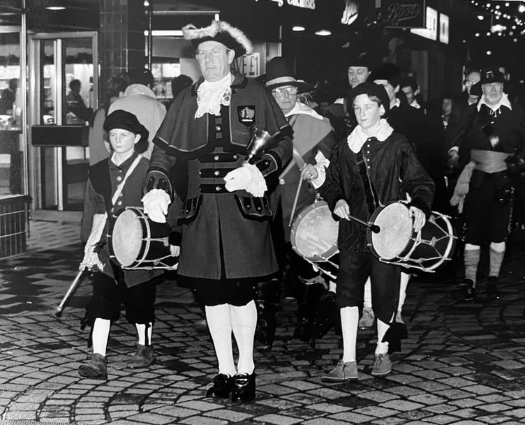 Newton Abbot town crier Ken Purchase leads the parade to start the town's Victorian Christmas Evening in December 1993