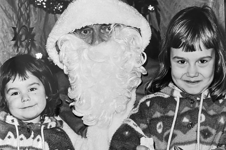 Roxanne and Jade Wilkins get to meet Father Christmas at Dawlish Ambulance Hall in December 1993