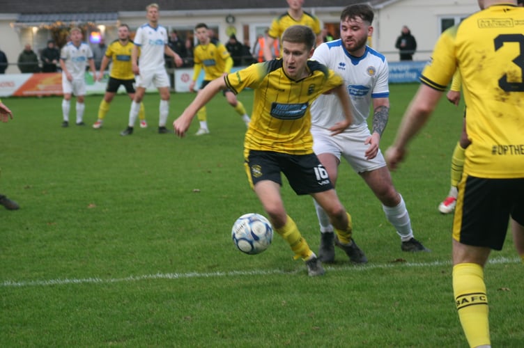 Owen Haslam in possession for Buckland Athletic