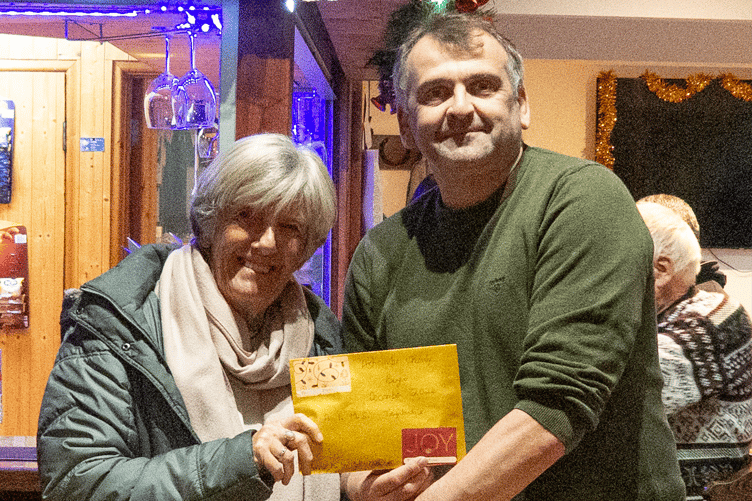 Matt Addicott presenting the cheque to Claire Combes from AIMS