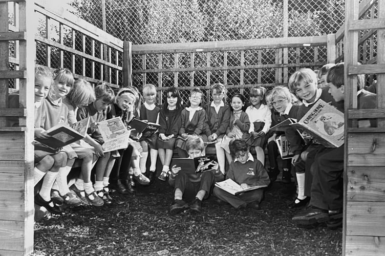 Pupils from Denbury Primary School enjoy their new outdoor reading shelter in September 1995