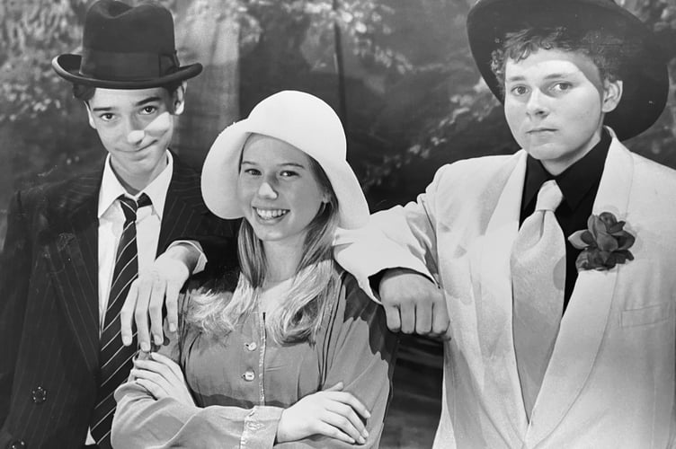 September 1995 and the Teignmouth Players were presenting Bugsy Malone at the Carlton Theatre. Pictured here are Derek Smith as Bugsy, Emma Escott as Blousey and Dominic Jeffery as Fat Sam