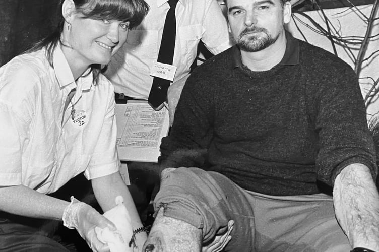 WBB First Aid Competition from November 1997. Vicki Page from British Gas SW team and  judge  and St John Ambulance County Trainer Arthur Twiggs with 'casualty' Andy Grady, a maintenance manager at WBB in Kingsteignton.