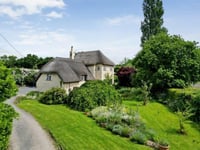 Thatched cottage for sale is "rare gem" with its own swimming pool 
