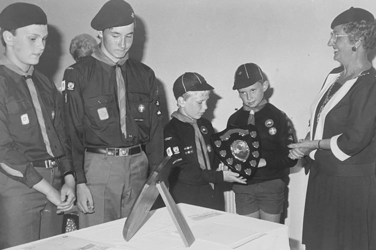 Scout Headquarters in Newton Abbot on June 22, 1989. Members of the 3rd Newton Abbot Scouts receive the St George's Day Shield from Teignbridge District Council chairman Maggie Stanton