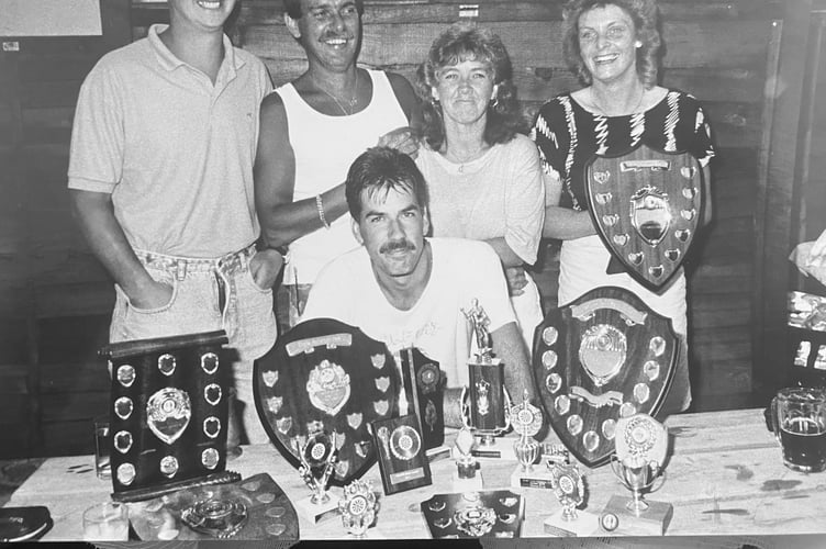 Teign Brewery's Mike Nolon, Ian WIliams, Chris Williams, Minnie Best (Women's Captain) and Nick Job (Men's Captain) with shields in volley ball competition from June 1989