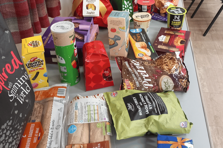 Newton Abbot's Slimming World group donated unwanted Christmas goods to HITS food bank