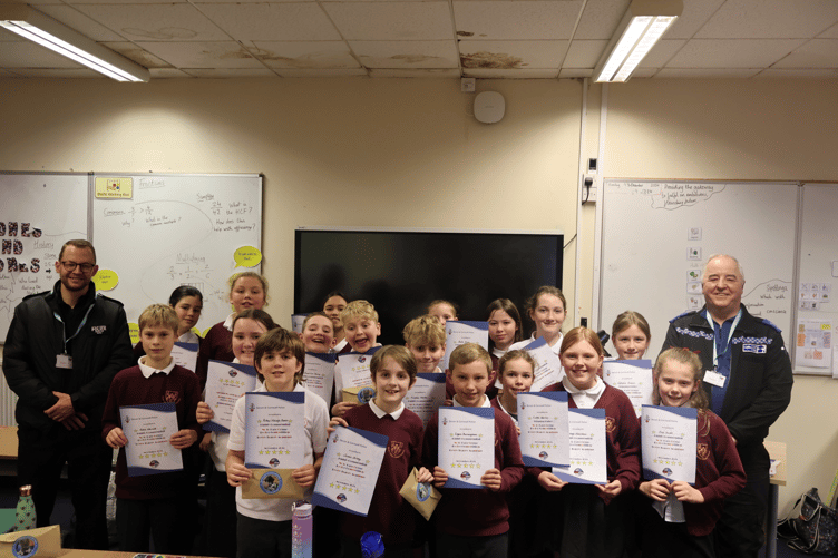 Bovey Tracey Academy pupils with PCSO Paul Wilson, right, and Inspector Roper, left.
