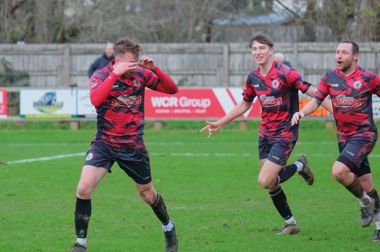Neil Last celebrates his goal for Bovey Tracey AFC against Honiton Town