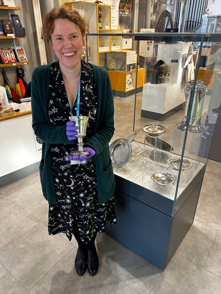 Curator Dr Charlotte Dixon with a piece of silverware on display at Newton Abbot Museum. Photo Nigel Canham