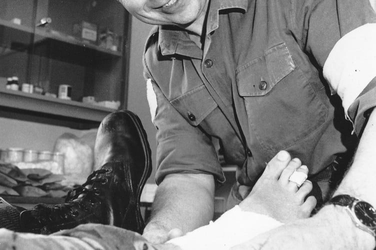 Ashburton's Claude Trudgill practises his first aid skills on a volunteer casualty during the 1989 Ten Tors event