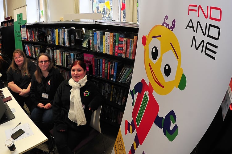Health and Wellbeing Fair held at Newton Abbot Library. Sam Lock, Mandy Hall and Emma Laskey from FrieNDs - a charity  that promotes awareness and support for those who have a diagnosis of Functional Neurological Disorder