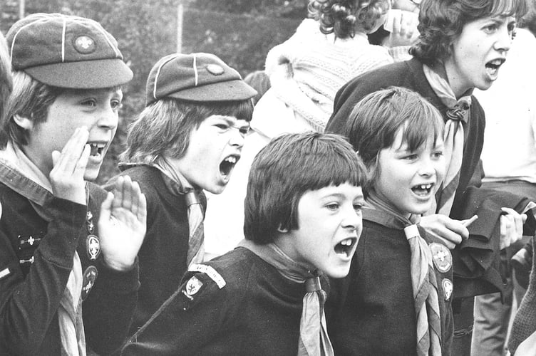 Teignbridge Cubs Sports Day from June 1976. Members of the 1st Newton Abbot Cubs cheer on their team
