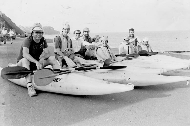 Paddle your own canoe! Members of Teignmouth Canoe Club await candidates for canoe lessons in June 1994