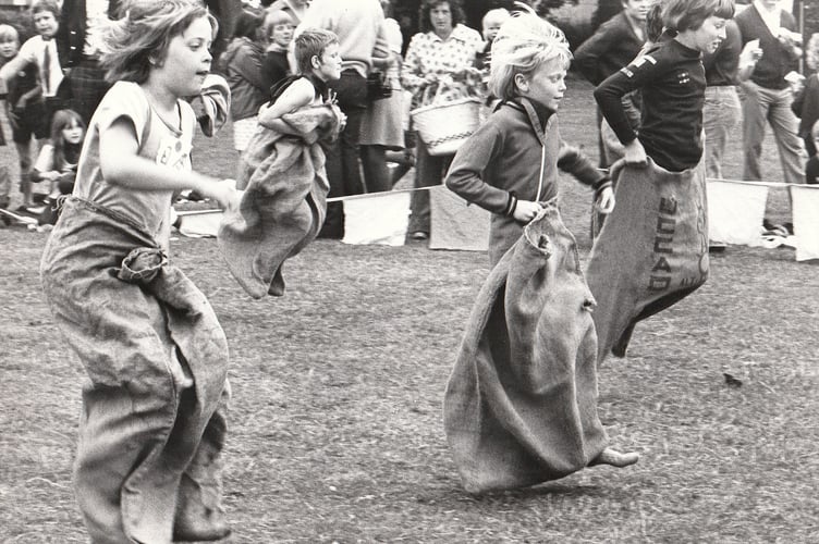 Teignbridge Cubs Sports Day from June 1976. Hitting the sack - the 10/11 age final of the sack race