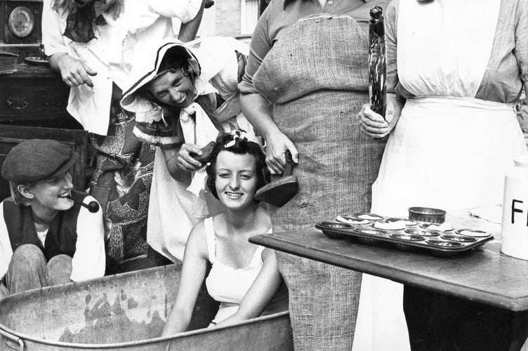 Bovey Tracey Carnival from 1976. Bath Night 1900 was Mrs J Peck's entry for the parade