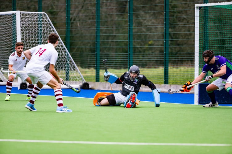 Paddy Walton in Ashmoor's goal makes a penalty corner save