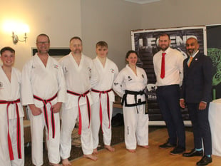 Black belt promotions for martial arts quintet