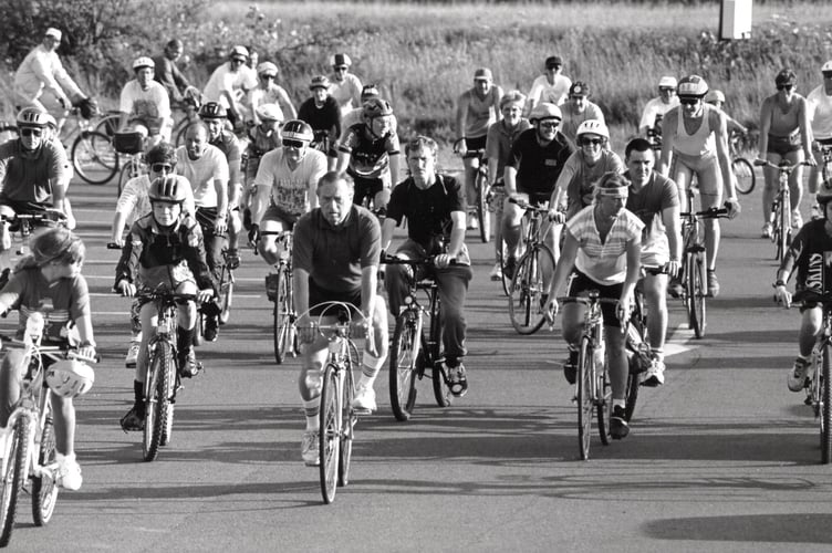 Cyclists head off at the start of a five mile challenge ride from Coombe Cellars on the banks of the River Teign on June 14, 1994