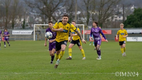 Jared Lewington with eyes on the ball for Buckland Athletic