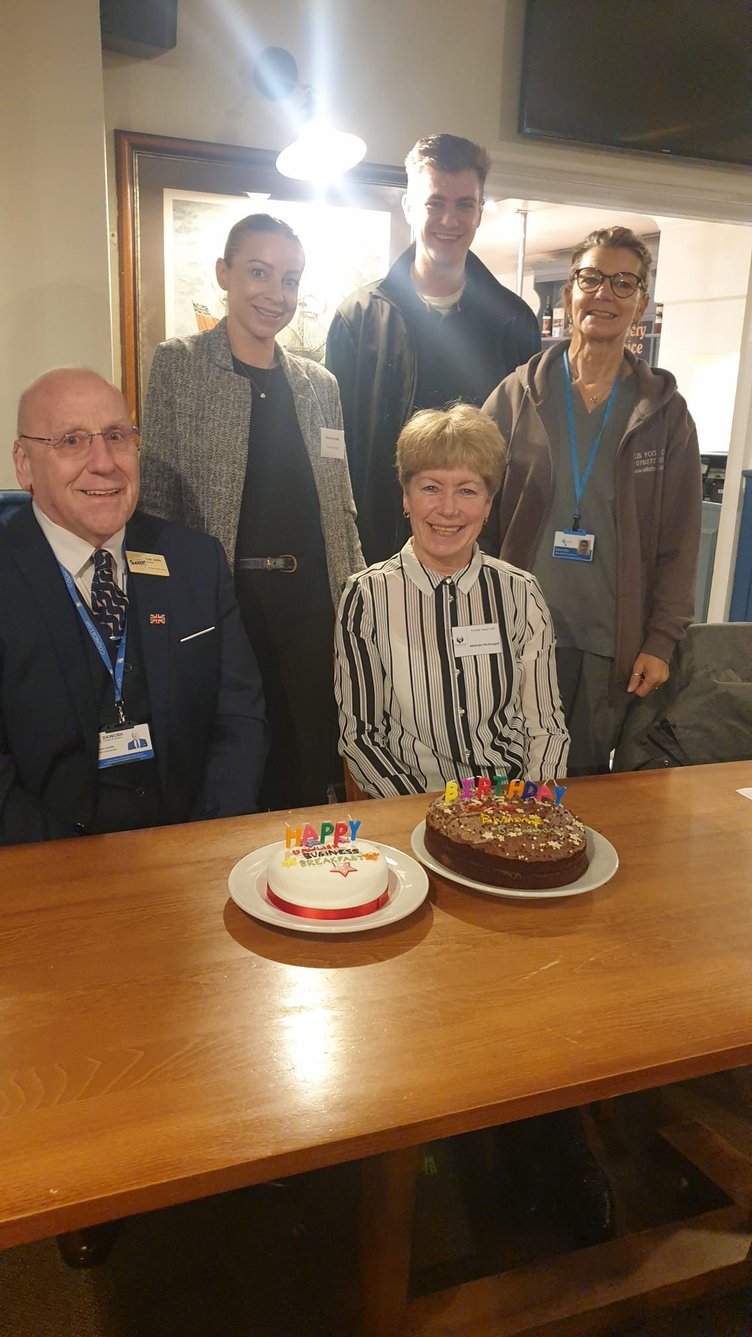 Dawlish Chamber of Commerce chair Colin Jolliffe (bottom left) and fellow chamber member and business breakfast organiser Melinda McDougall (bottom right) celebrate the first anniversary of the popular networking event. (Photo Fiona McBride)