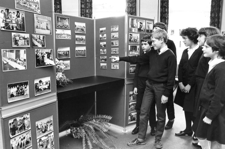 Pupils from Teign School looking at pictures from the past in an exhibition celebrating the school's 50th jubilee in April 1986