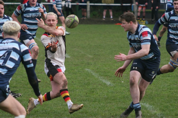 Owen McLeod spins a pass out for Newton Abbot RFC