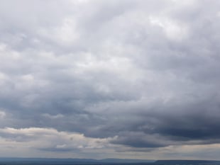 Mist clearing to sunny spells today then patchy rain tomorrow