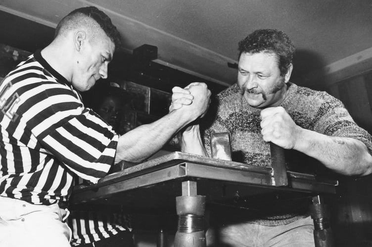 Arm wrestling championship held at the First and Last Pub in Teignmouth in mid-November 1990. Here's Rod 'Rambo' Lenette taking on Teignmouth's Geoff Staniland