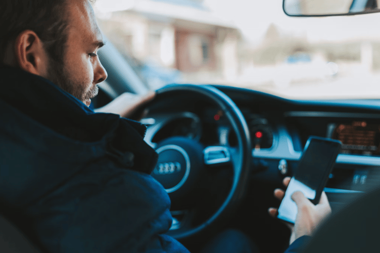 Using phone while driving stock image