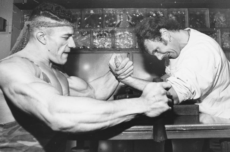 Arm wrestling championship held at the First and Last Pub in Teignmouth in mid-November 1990. British professional champion armwrestler Rod 'Rambo' Lenette and Bovey Tracey's Paul Brealey