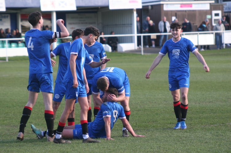 Newton Abbot Spurs celebrate their fourth against Elburton