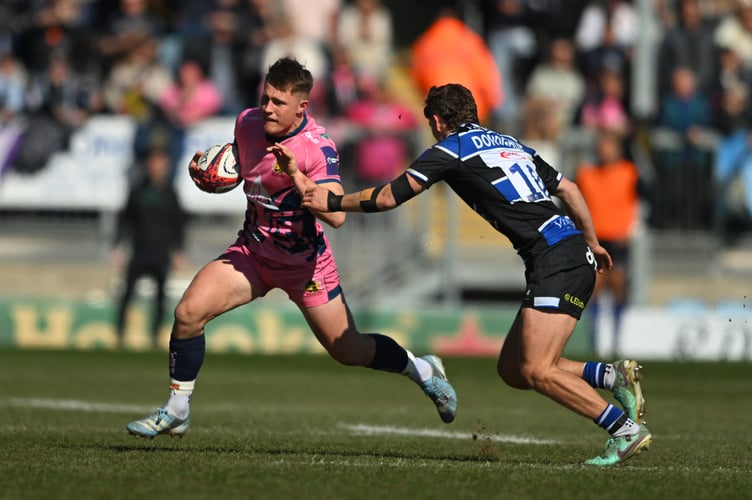 Exeter Chiefs back Will Haydon-Wood looks to find a way past Bath's Ruairdh McConnochie