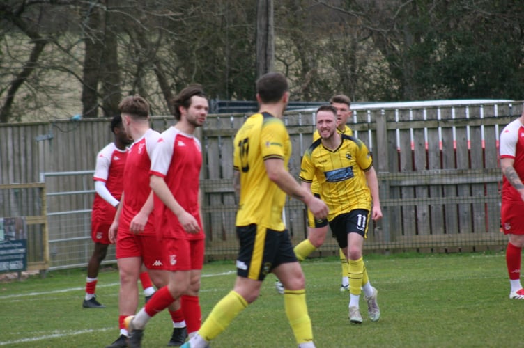 Luke Forward celebrates his equaliser for Buckland Athletic