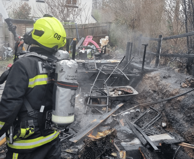 Garden ravaged by fire as crews save house 