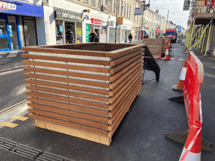 Planters in place ahead of trees
