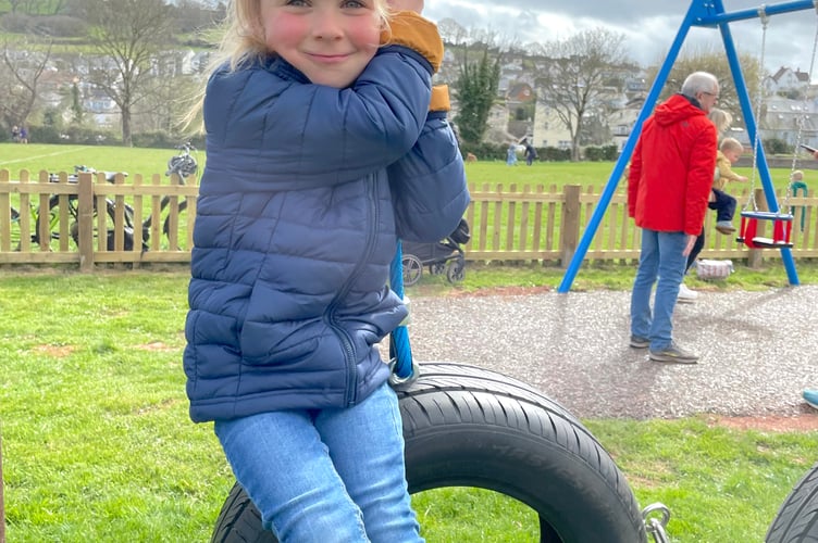 Korina on the tyres at Shaldon play park