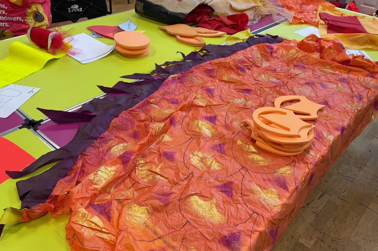 The dragon is being made entirely from recycled materials