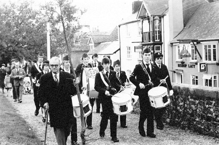 Procession from Chudleigh Church in October 1982 for a tree planting to commemorate that year's  twinning of the town with Troarn in Normandy, France.