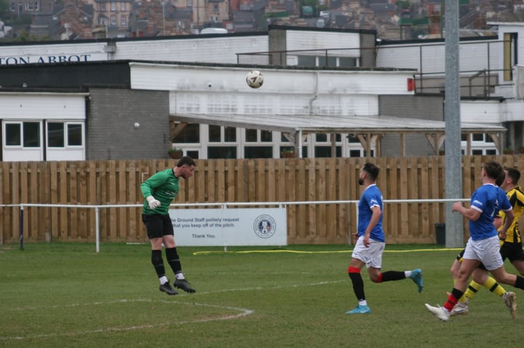 NA Spurs 2nds goalkeeper Taylor Breslan heads away versus Beesands