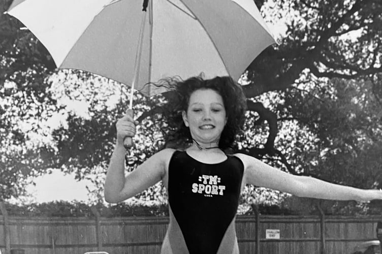 Lovely weather for a swim at Kingsteignton's swimming pool in April 1995. Thirteen-year old Jenny Sandford assists with the official opening for that year's season.