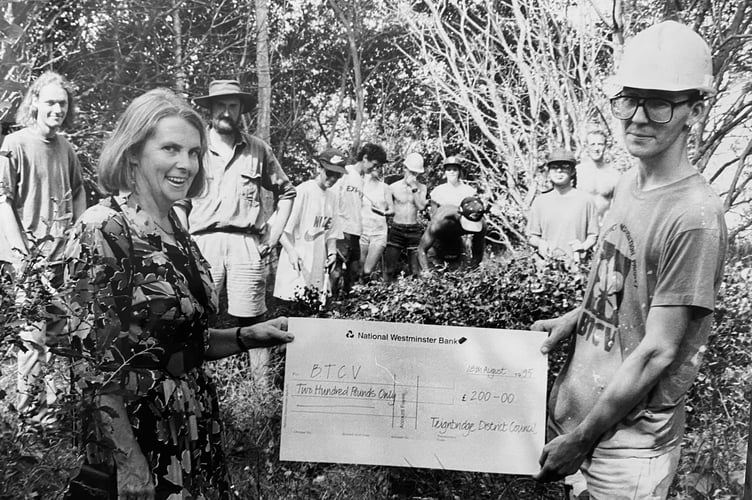 Dawlish Warren Nature in August 1995. Rhona Parker from Teignbridge District Council presents Peter Parry, chairman of the conservation volunteers ,with a cheque to spend on new tools