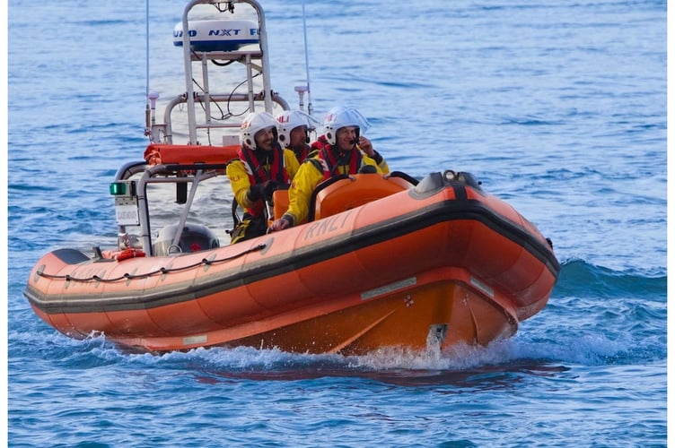 Teignmouth RNLI volunteers on board the inshore B-Class Atlantic 85 inshore lifeboat, Claude and Kath. Photo: Paul Venning Photography / RNLI