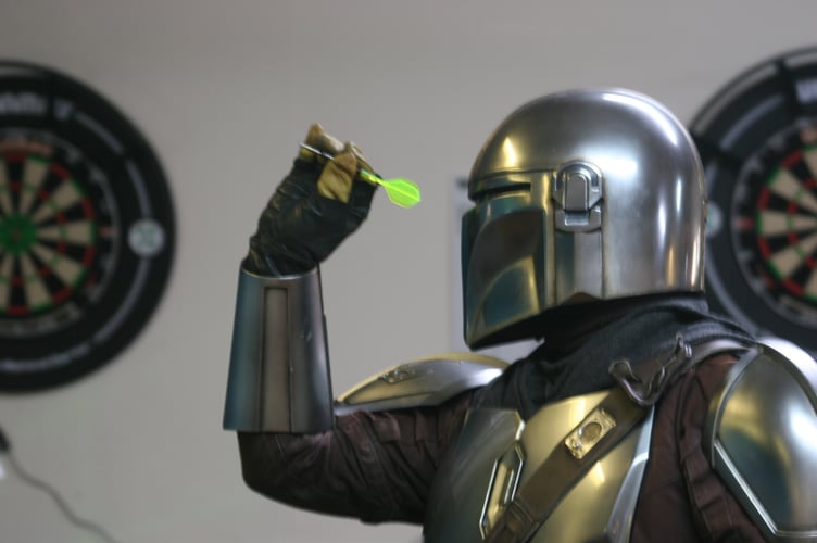 The Mandalorian with dart in hand