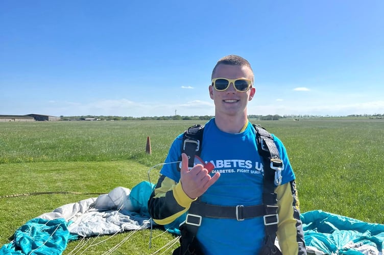 Dom Slader safely back on the ground after skydiving to raise money for Diabetes UK