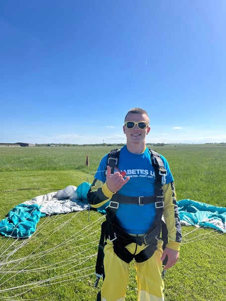 Dom Slader safely back on the ground after skydiving to raise money for Diabetes UK