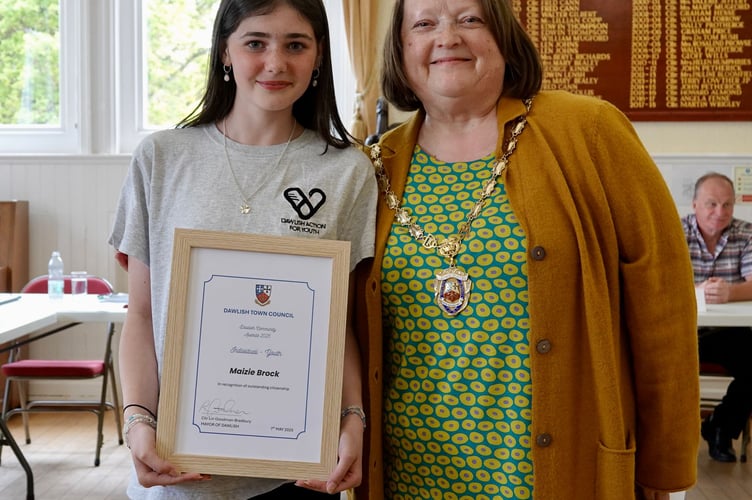 Maizie Brock presented with the Dawlish Community Award by outgoing mayor Cllr Lin Goodman-Bradbury. photo BOB SIMPSON
