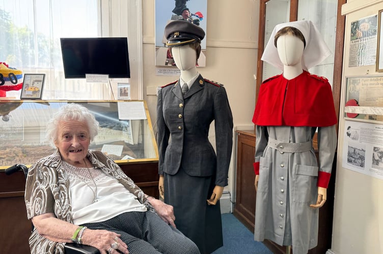 June Sutton with her Army nursing uniform now on display at Dawlish Museum. Photo BOB SIMPSON 