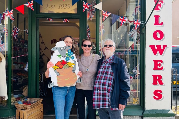 Chudleigh town councillors Gina Sherwood, mayor Emma Hares and Michael McCormick with one of the sheep plaques
