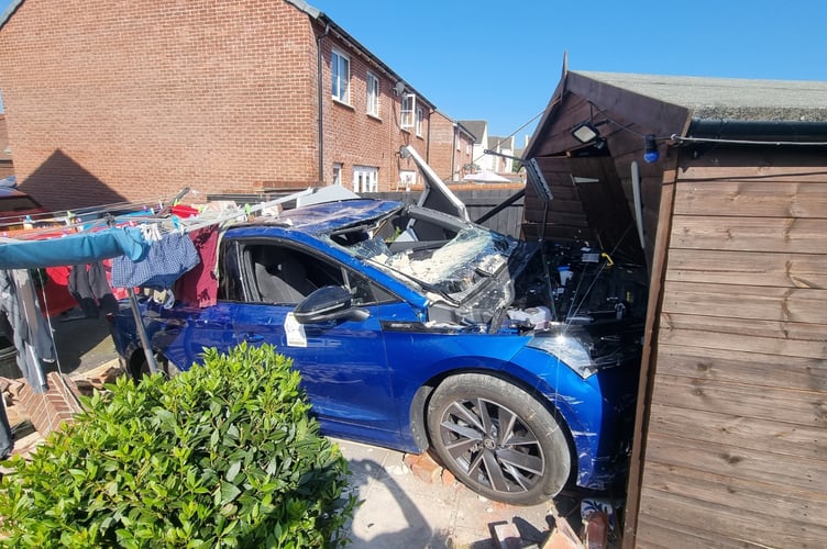 Narrowly missing the washing line, the car crashed into a garden shed 